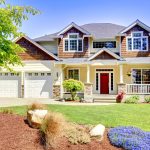 Large American beautiful house with red door.